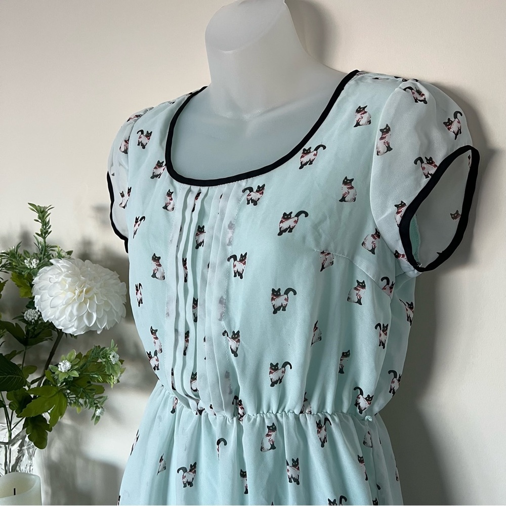 Mint-green cat-print Doe and Rae mini dress